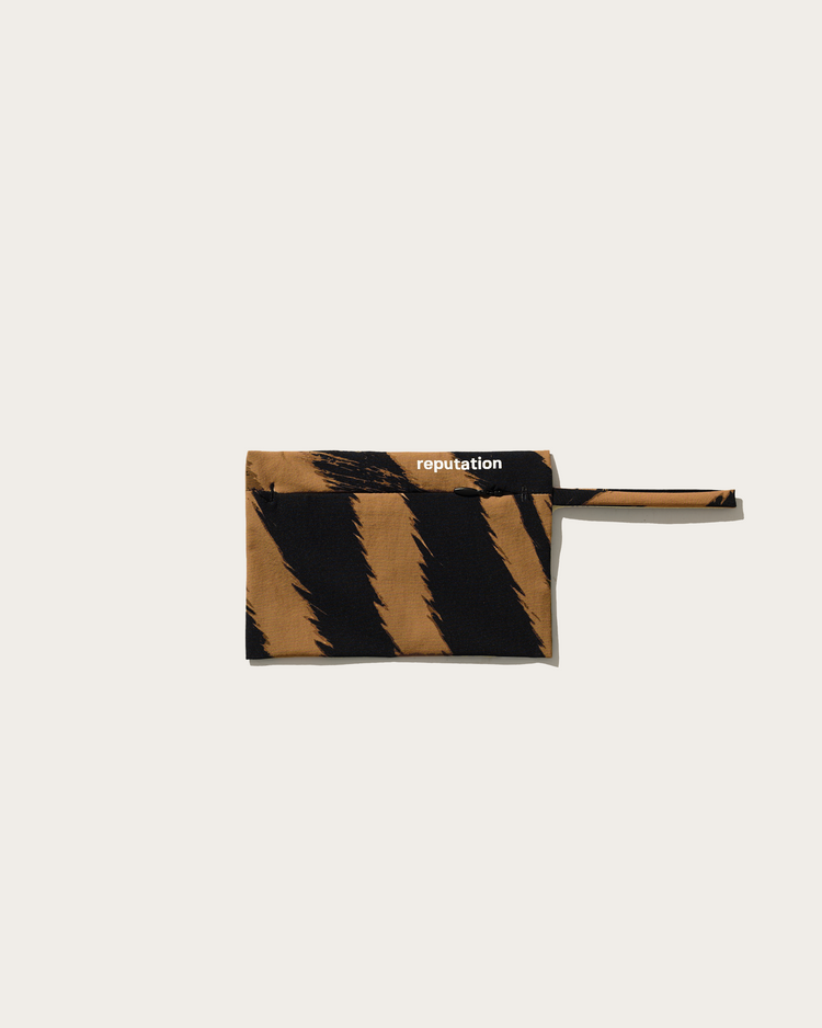 Reputation brown zebra swimwear packaging pouch, flat lay